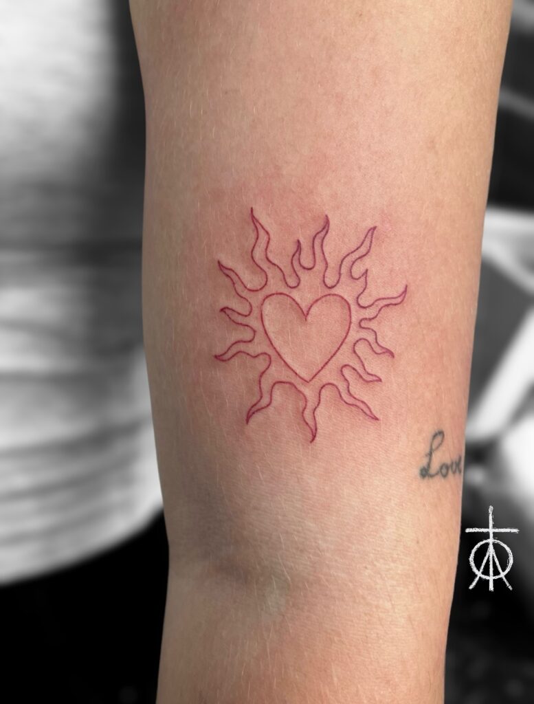 Fine Line Red Ink Sun Tattoo by The Best Fine Line Tattoo Artist Claudia Fedorovici