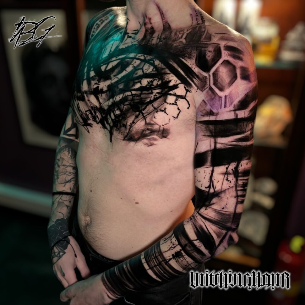 Custom Abstract Blackwork Brushstroke Tattoo, chest and sleeve By The Best Tattoo Artist Bobby Grey
